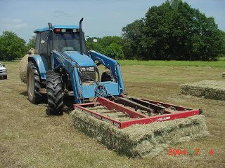 Loading photo of square bale moving...